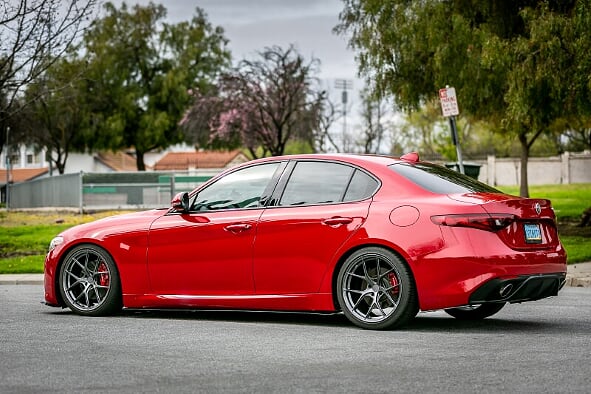 Aspira AV-5 gun metal wheels on red alfa romeo