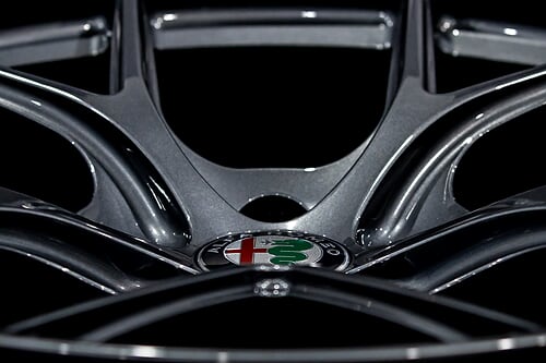 Aspira AV-5 gun metal side view of alfa romeo logo