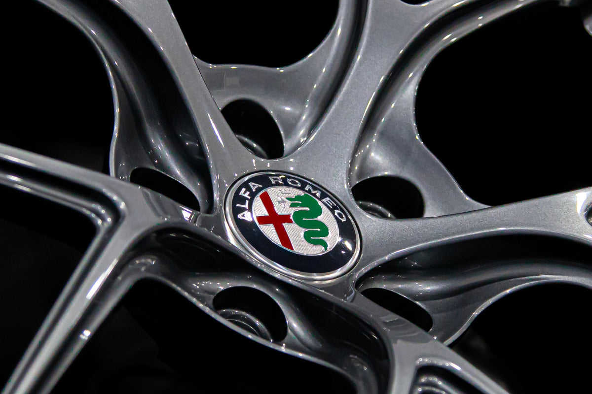 Aspira AV-5 gun metal close view of alfa romeo logo